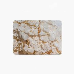 Floral cream bleached hydrangeas on blue bathmat